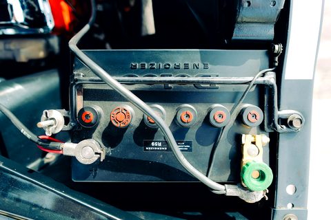 Car battery seen close up, terminals and cables connected