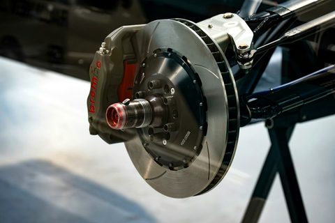 Brake disc and caliper seen close up on a wheel hub